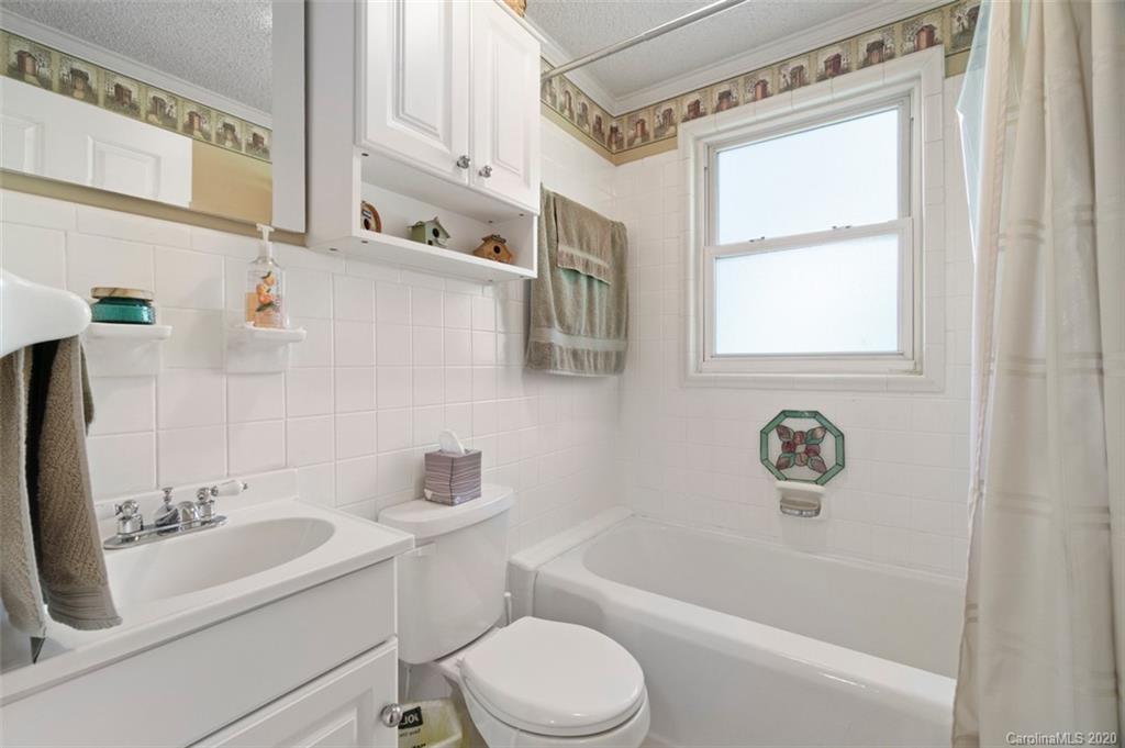 185 Hunter Bridge Road Stony Point, NC 28678 - Photo 22 of 47 a bathroom with a sink toilet and shower