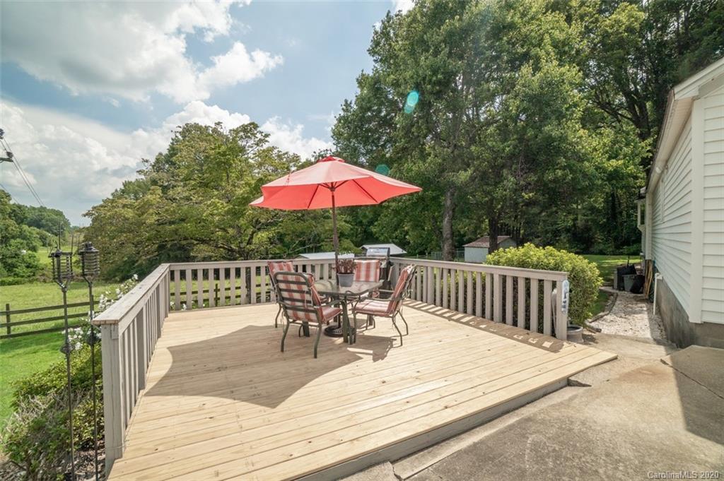 185 Hunter Bridge Road Stony Point, NC 28678 - Photo 23 of 47 a view of balcony with wooden floor and outdoor seating