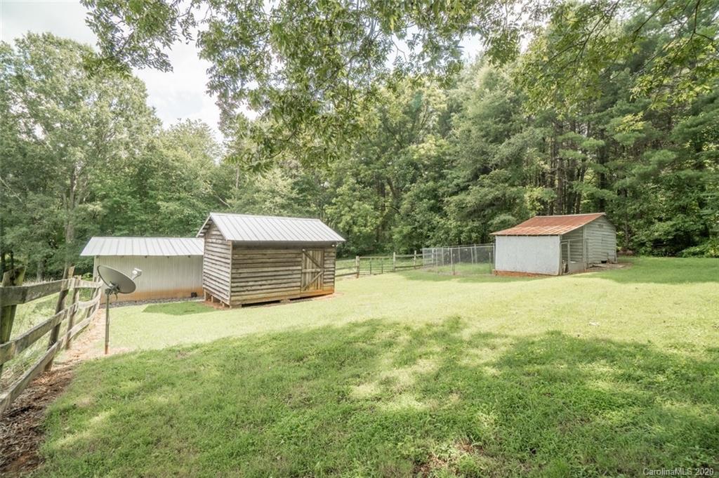 185 Hunter Bridge Road Stony Point, NC 28678 - Photo 24 of 47 a backyard of a house with yard and barbeque oven