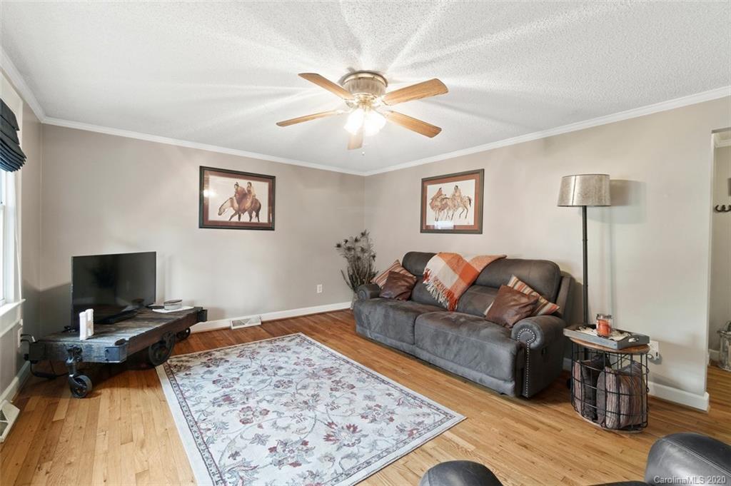 185 Hunter Bridge Road Stony Point, NC 28678 - Photo 4 of 47 a living room with furniture and a rug