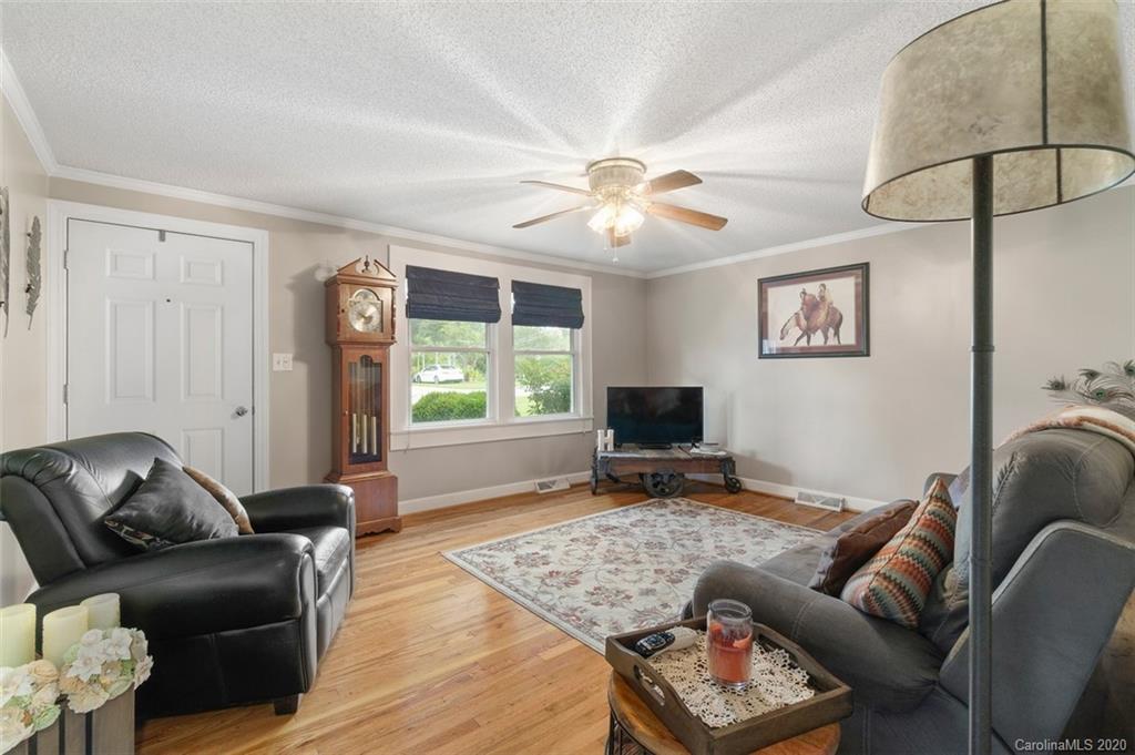 185 Hunter Bridge Road Stony Point, NC 28678 - Photo 5 of 47 a living room with furniture and a flat screen tv