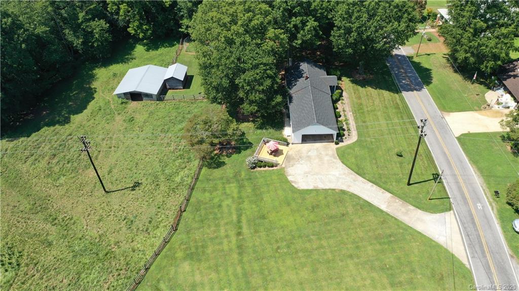 185 Hunter Bridge Road Stony Point, NC 28678 - Photo 45 of 47 a view of a swimming pool with a garden