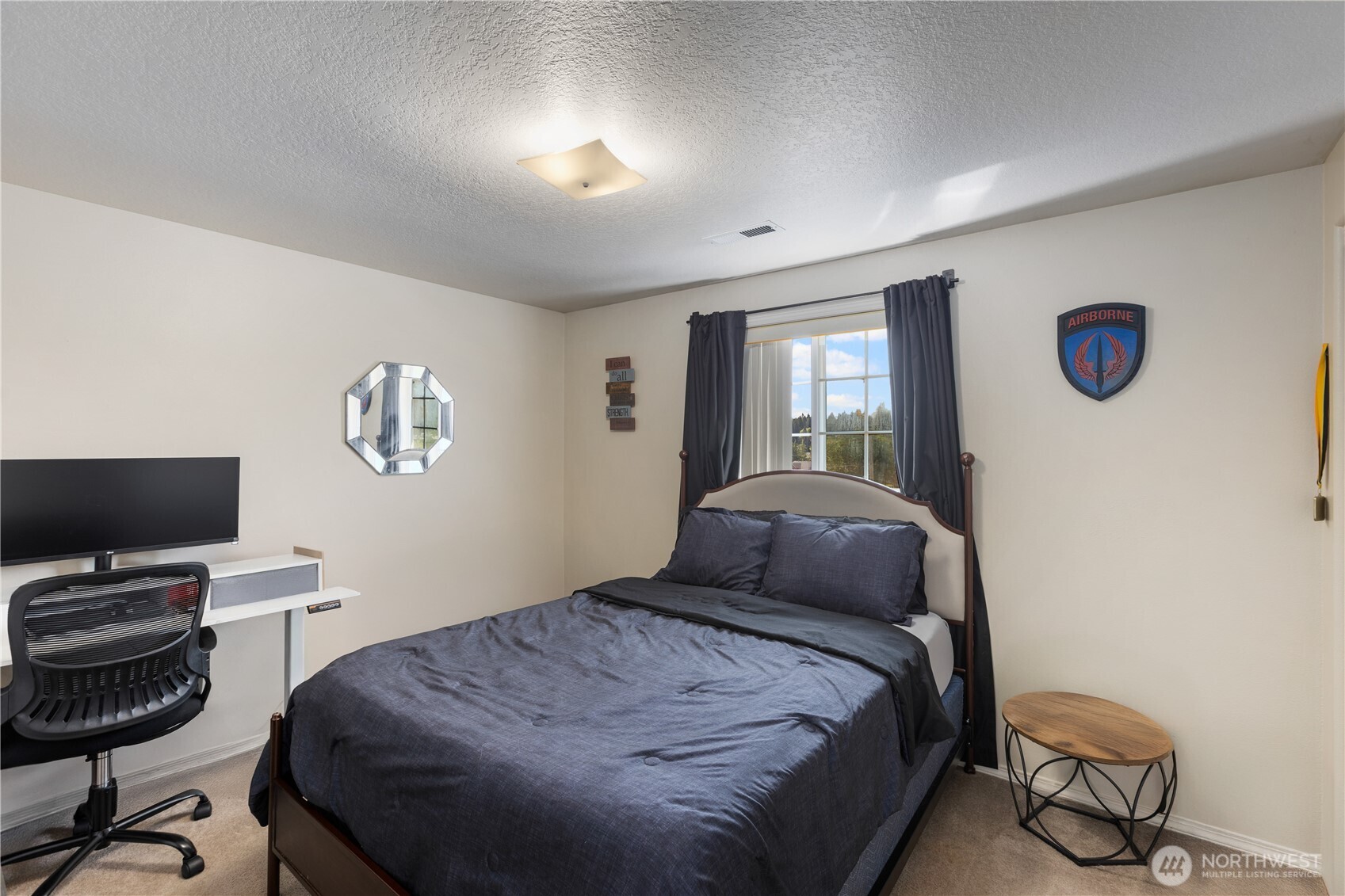 8305 Sweetbrier Loop Southeast Olympia, WA 98513 - Photo 26 of 40 a bedroom with a bed and a desk
