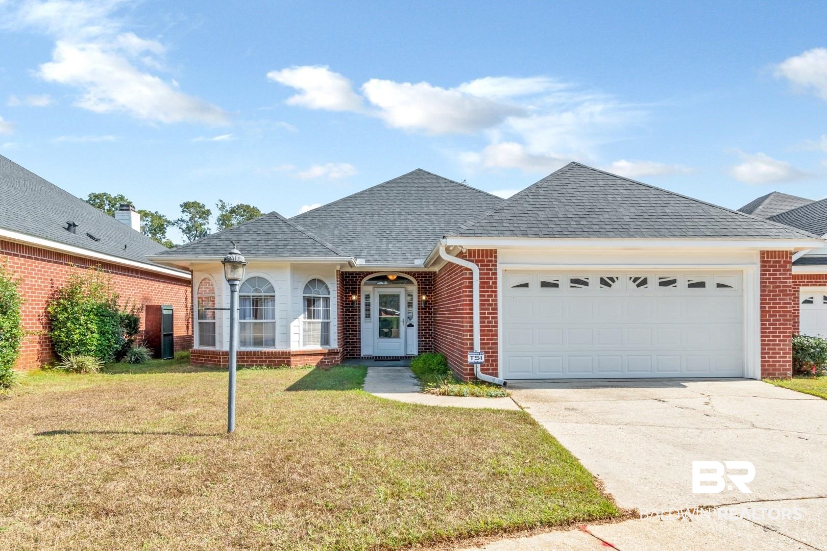 6117 Lennox Place Mobile, AL 36693 - Photo 36 of 39 Single story home featuring roof with shingles, brick siding, a front lawn, concrete driveway, and an attached garage