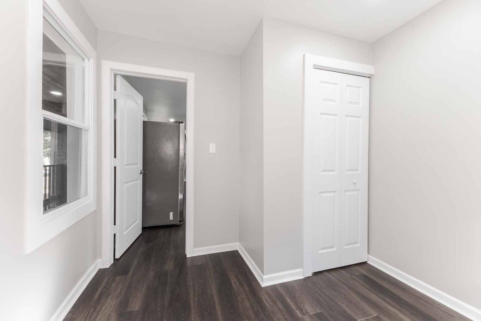 306 East Martin Street Forrest, IL 61741 - Photo 17 of 32 a view of a hallway with wooden floor and closet