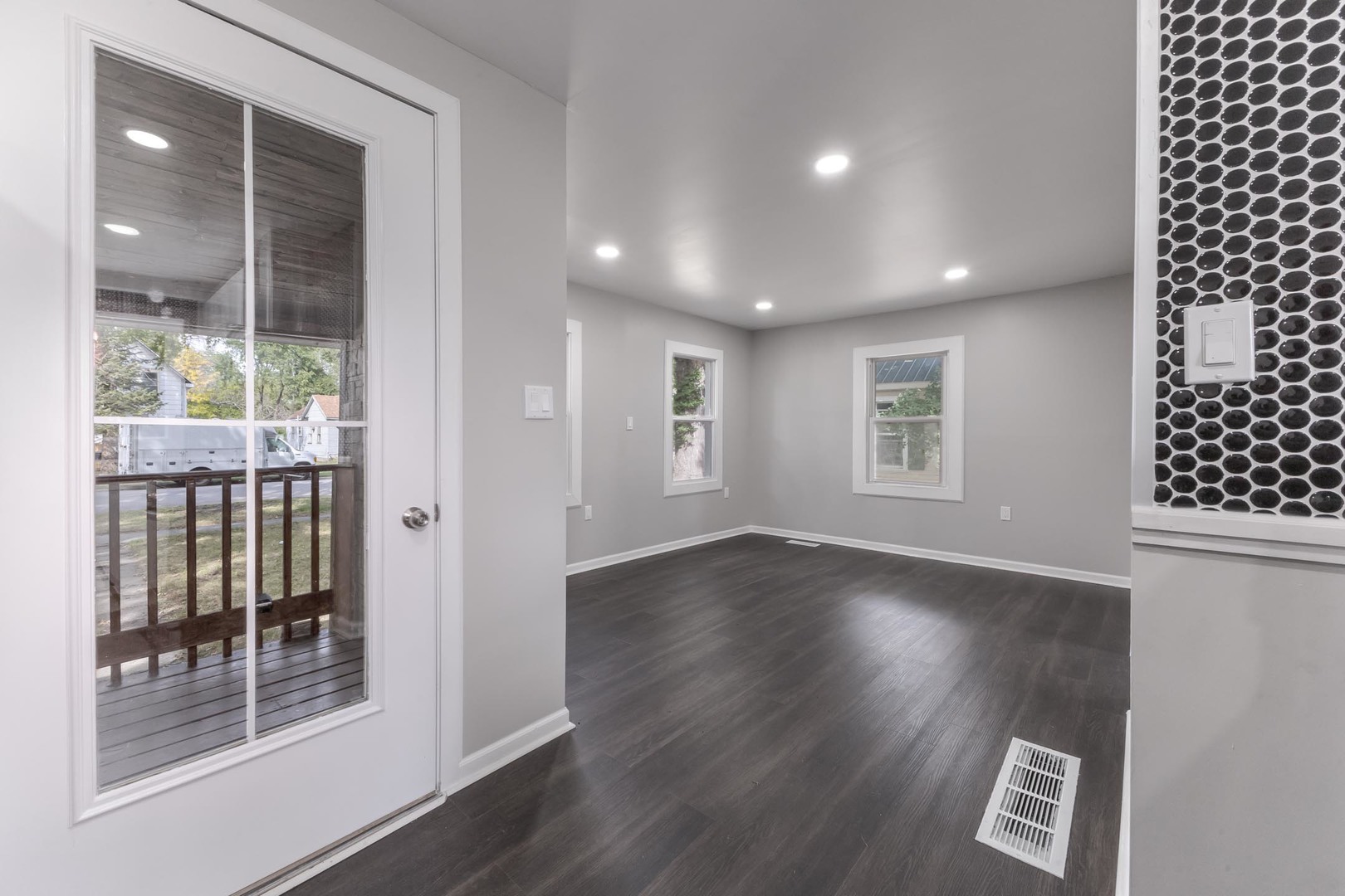306 East Martin Street Forrest, IL 61741 - Photo 24 of 32 an empty room with wooden floor and windows