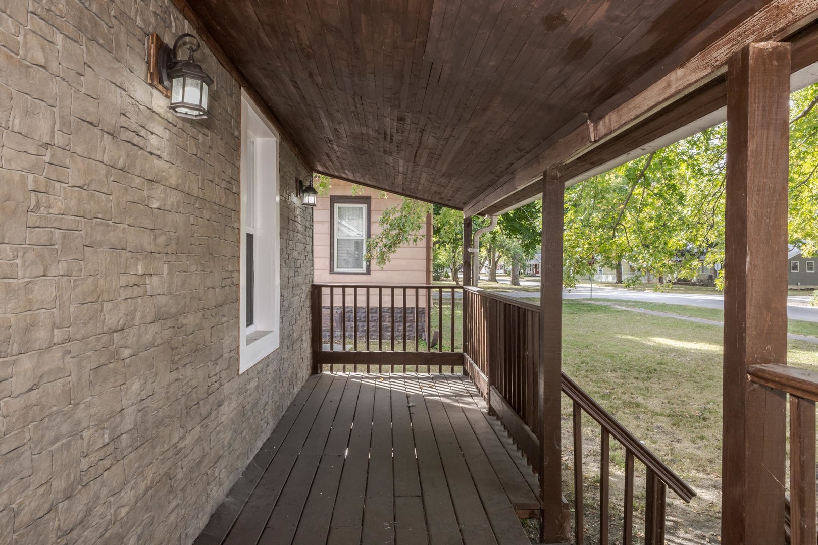 306 East Martin Street Forrest, IL 61741 - Photo 6 of 32 a view of a balcony with wooden floor