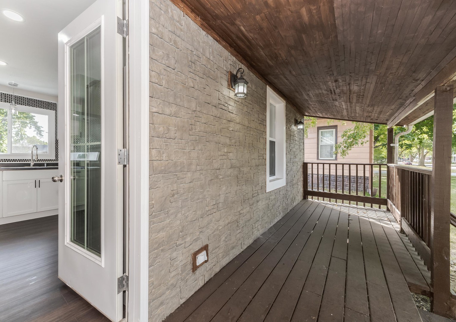 306 East Martin Street Forrest, IL 61741 - Photo 8 of 32 a view of a balcony with wooden floor
