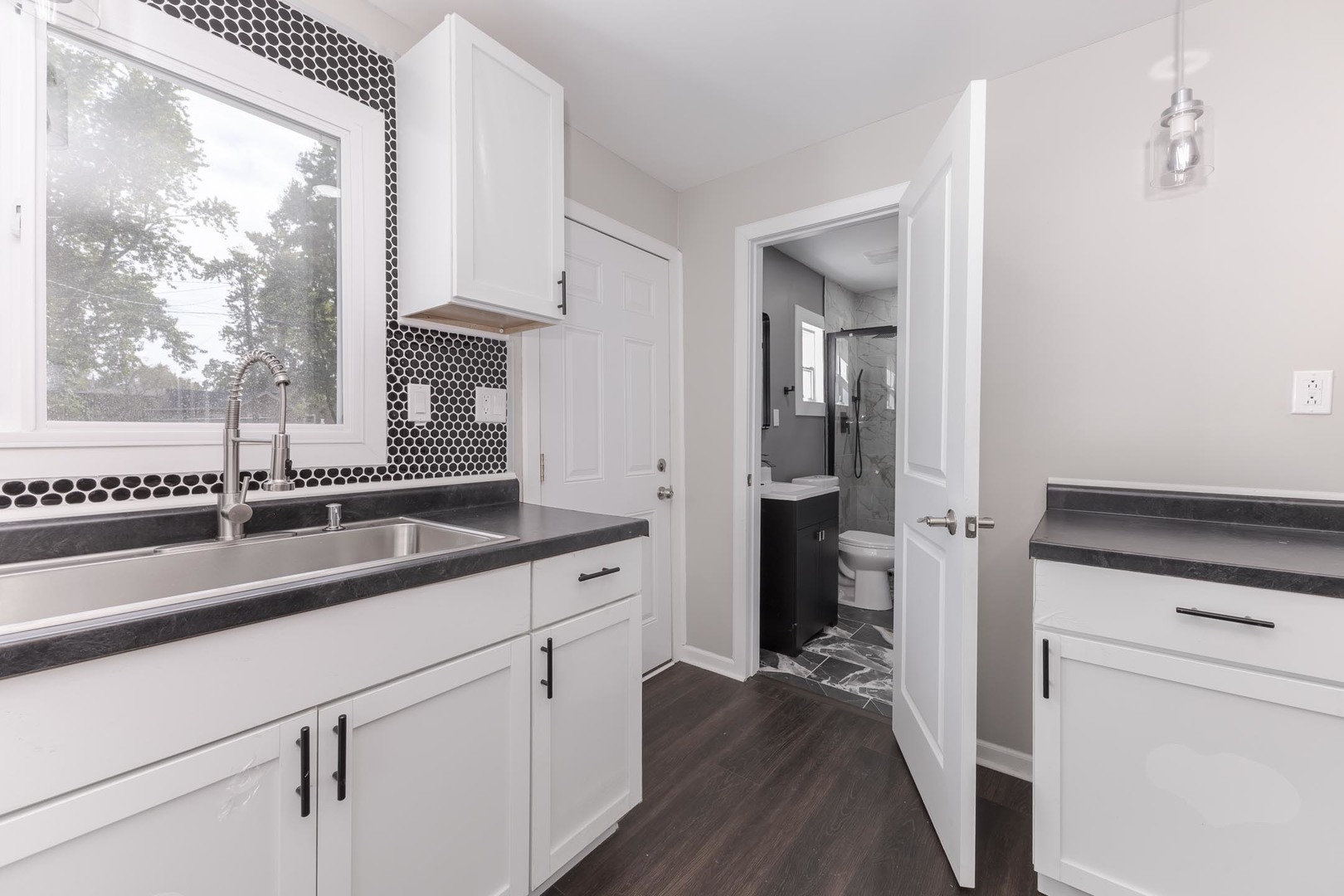 306 East Martin Street Forrest, IL 61741 - Photo 10 of 32 a kitchen with a sink and a wooden floor