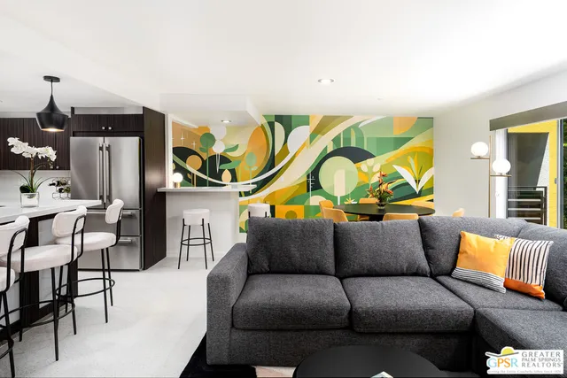 a living room with furniture and a potted plant