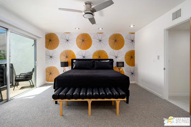 a kitchen with kitchen island white cabinets and refrigerator