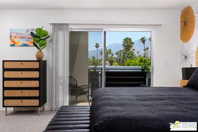 a bedroom with bed and window