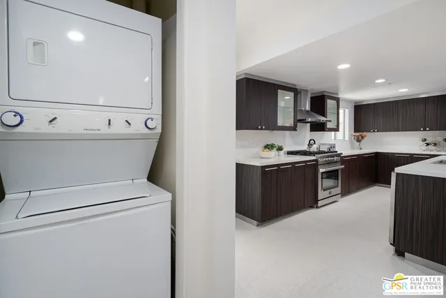 a view of a pathway with a flower garden