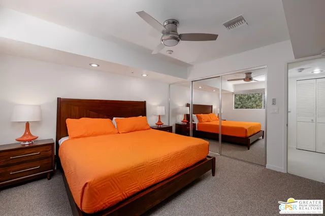 a view of a swimming pool with chair and table