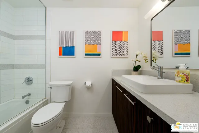 a view of a swimming pool with a lounge chairs