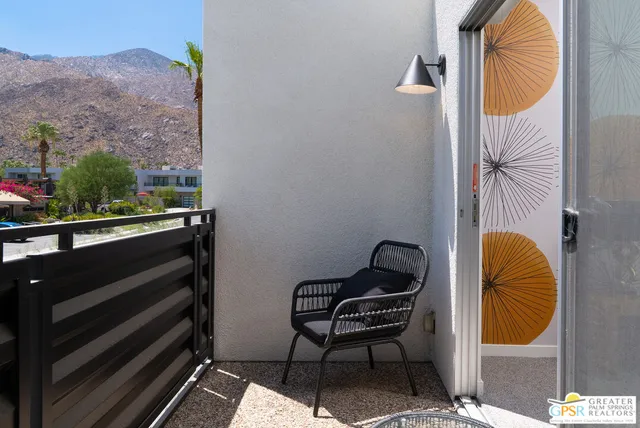 a view of a chairs and table in the patio