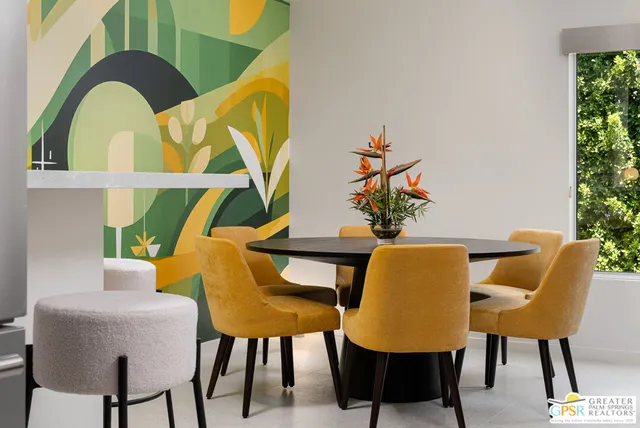 a kitchen with stainless steel appliances kitchen island granite countertop a sink and a refrigerator