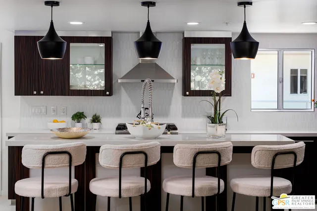 a view of kitchen with a potted plant on the counter