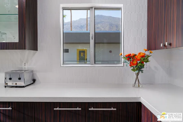 a view of kitchen island with stainless steel appliances