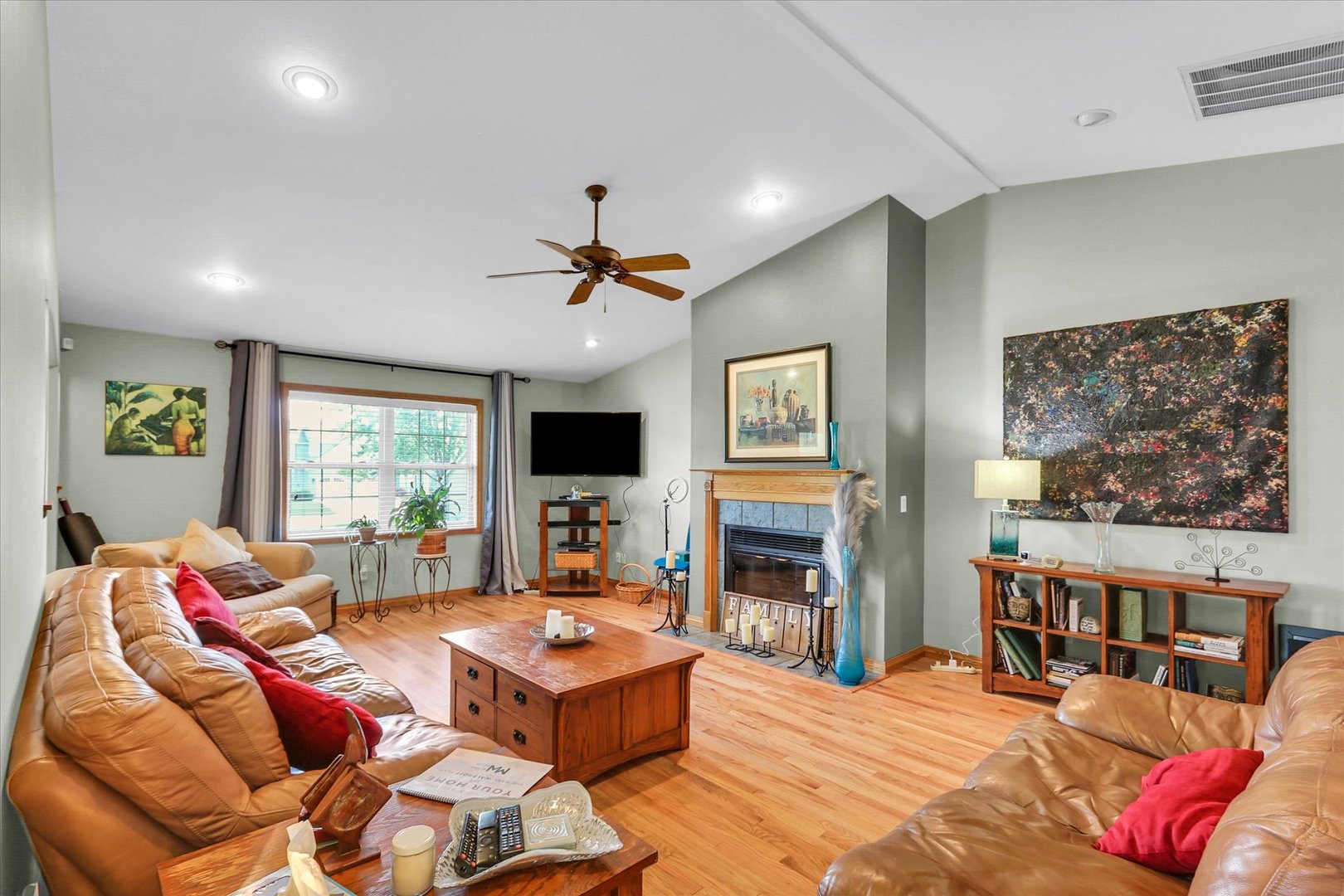 3110 Ridge Park Road Urbana, IL 61802 - Photo 2 of 26 a living room with furniture a flat screen tv and a fireplace