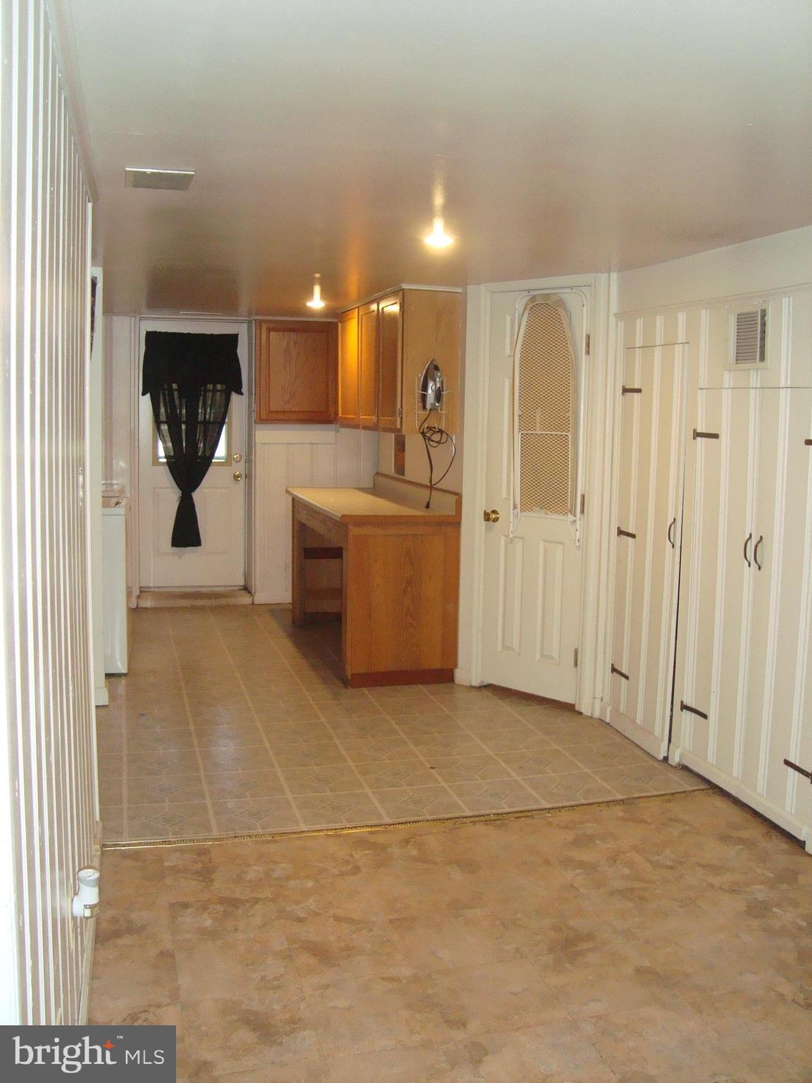140 Wiltshire Road Baltimore, MD 21221 - Photo 24 of 34 Family Room View Towards the Laundry Room