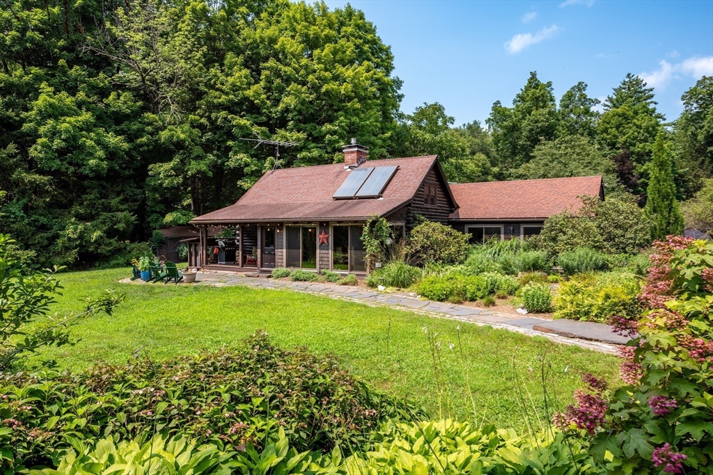 82 Juggler Meadow Road Leverett, MA 01054 - Photo 3 of 41 a front view of a house with garden
