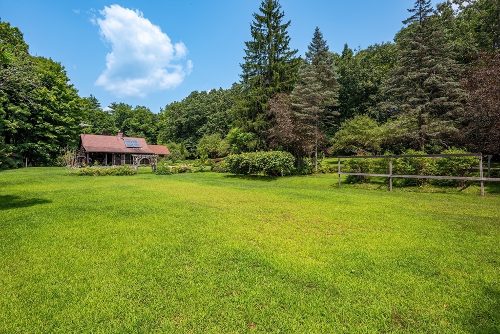 82 Juggler Meadow Road Leverett, MA 01054 - Photo 4 of 41 a view of a garden with houses