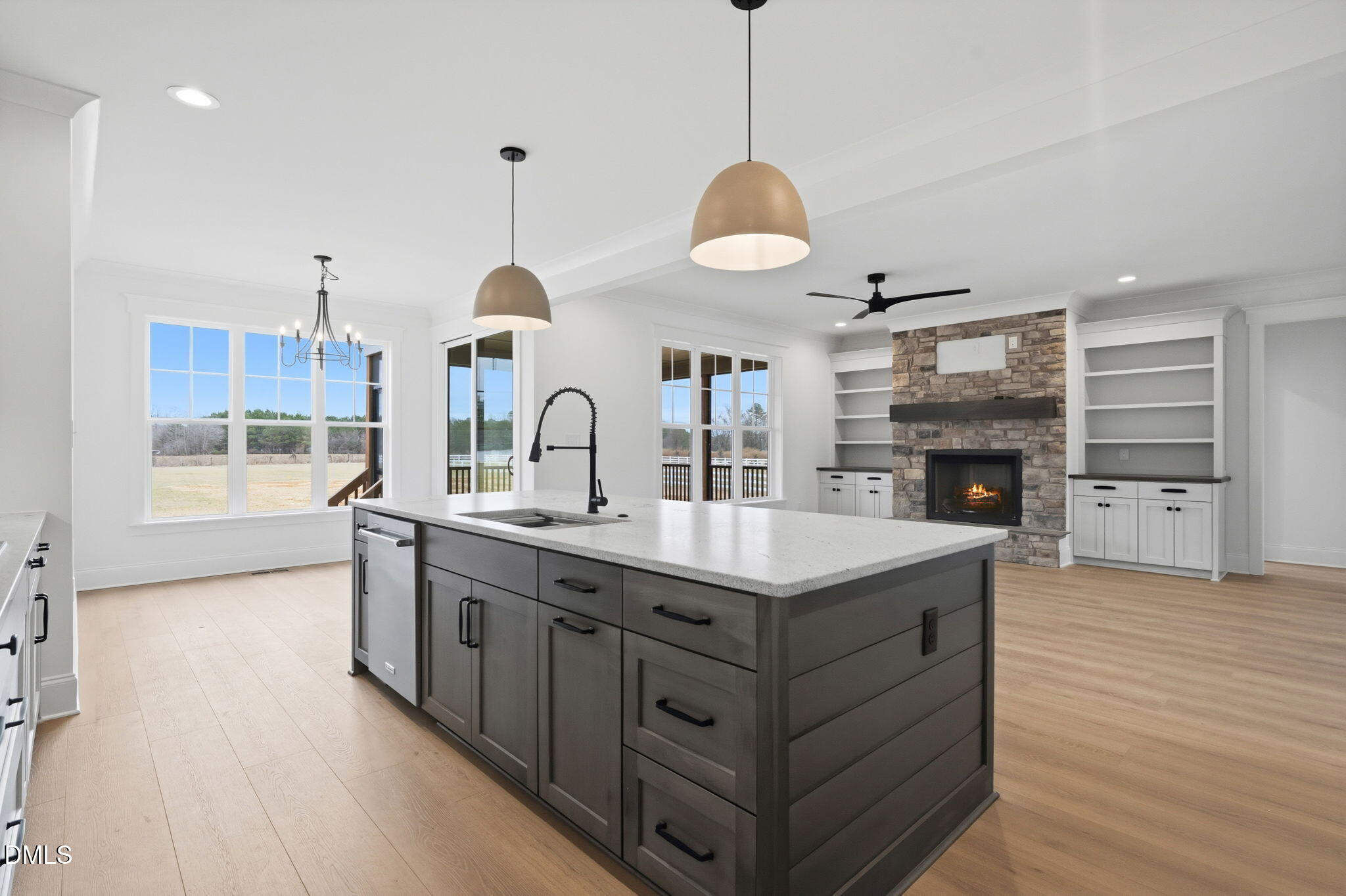 11214 Old Beulah Road Kenly, NC 27542 - Photo 17 of 56 a kitchen with kitchen island granite countertop a sink a stove and a wooden floors