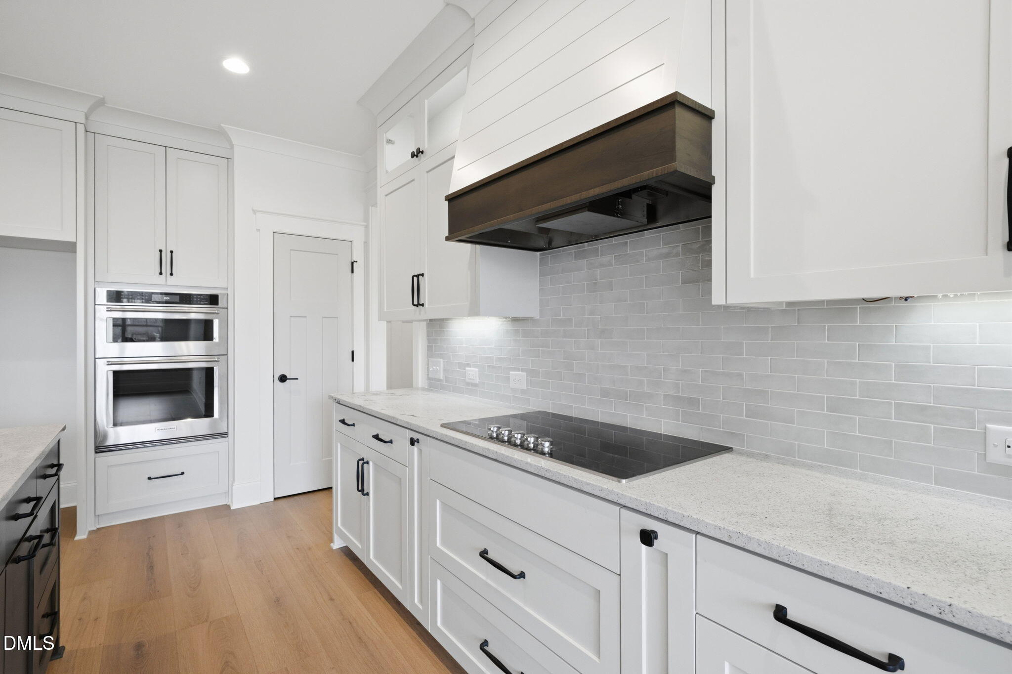 11214 Old Beulah Road Kenly, NC 27542 - Photo 18 of 56 a kitchen with stainless steel appliances white cabinets and a stove a oven with white countertops