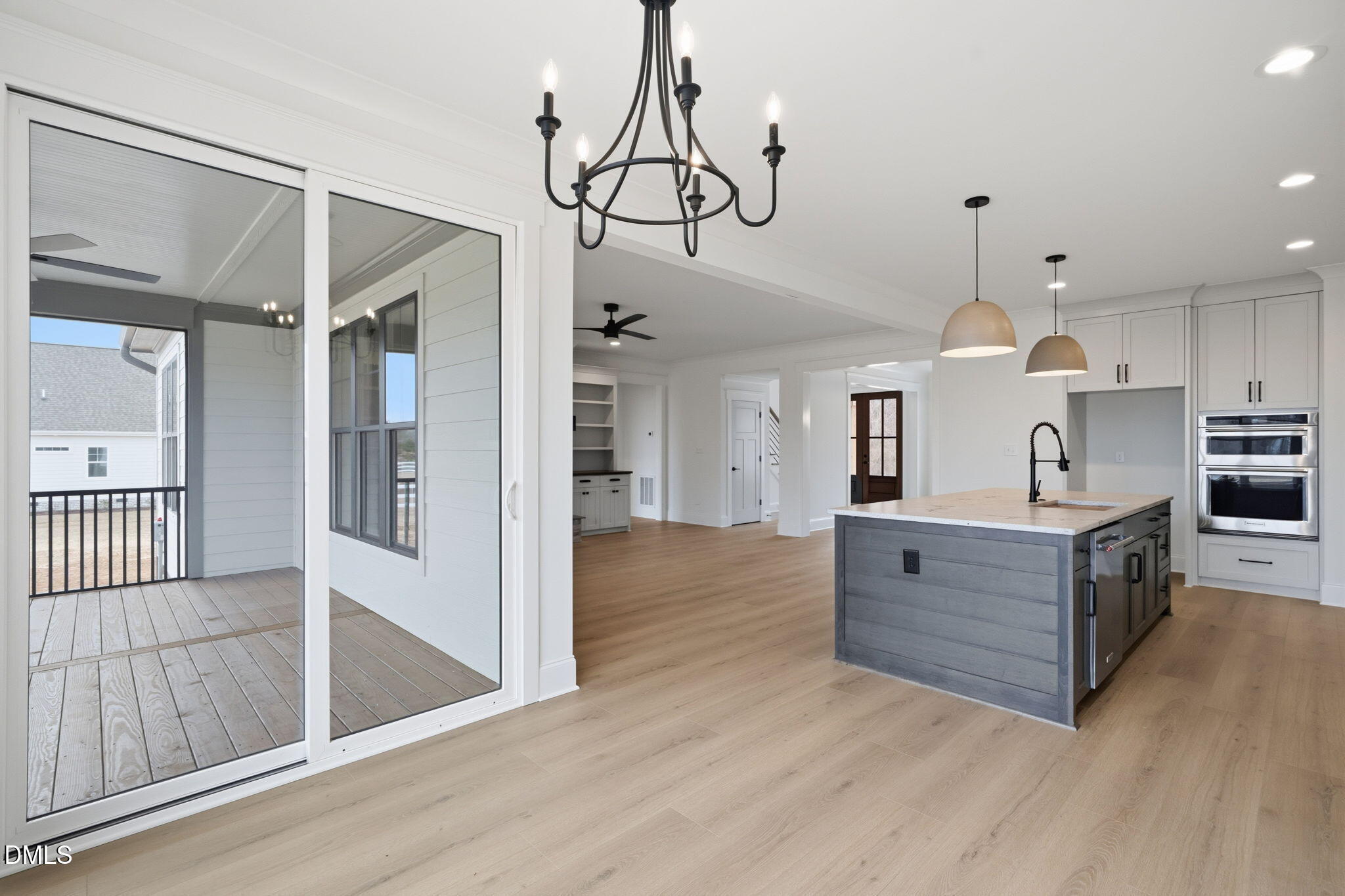 11214 Old Beulah Road Kenly, NC 27542 - Photo 21 of 56 a view of a kitchen with wooden floor and stainless steel appliances