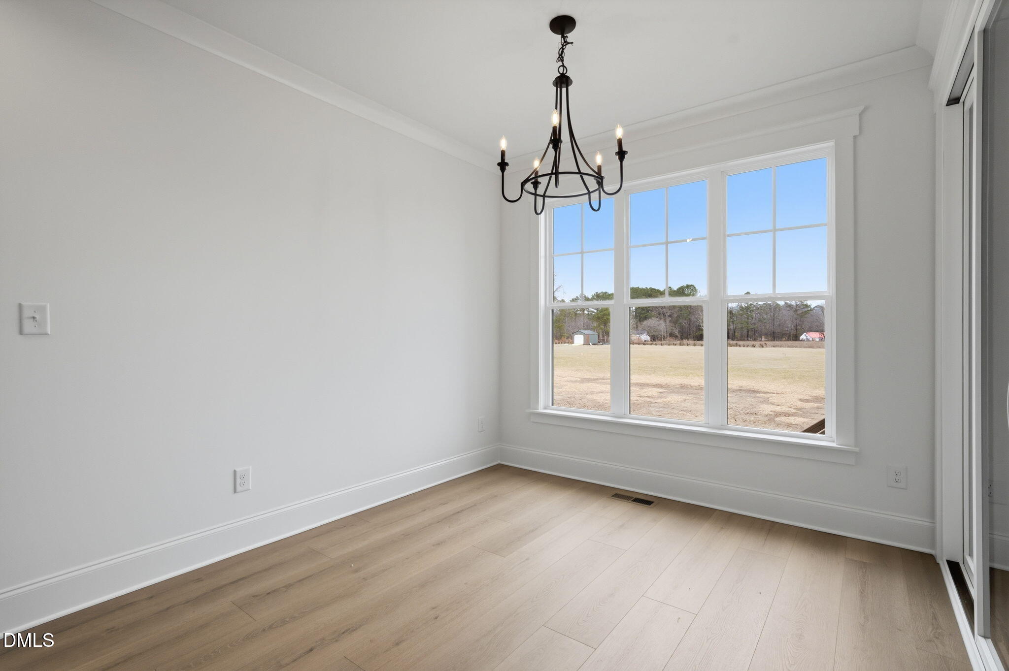 11214 Old Beulah Road Kenly, NC 27542 - Photo 22 of 56 a view of a kitchen with wooden floor and windows