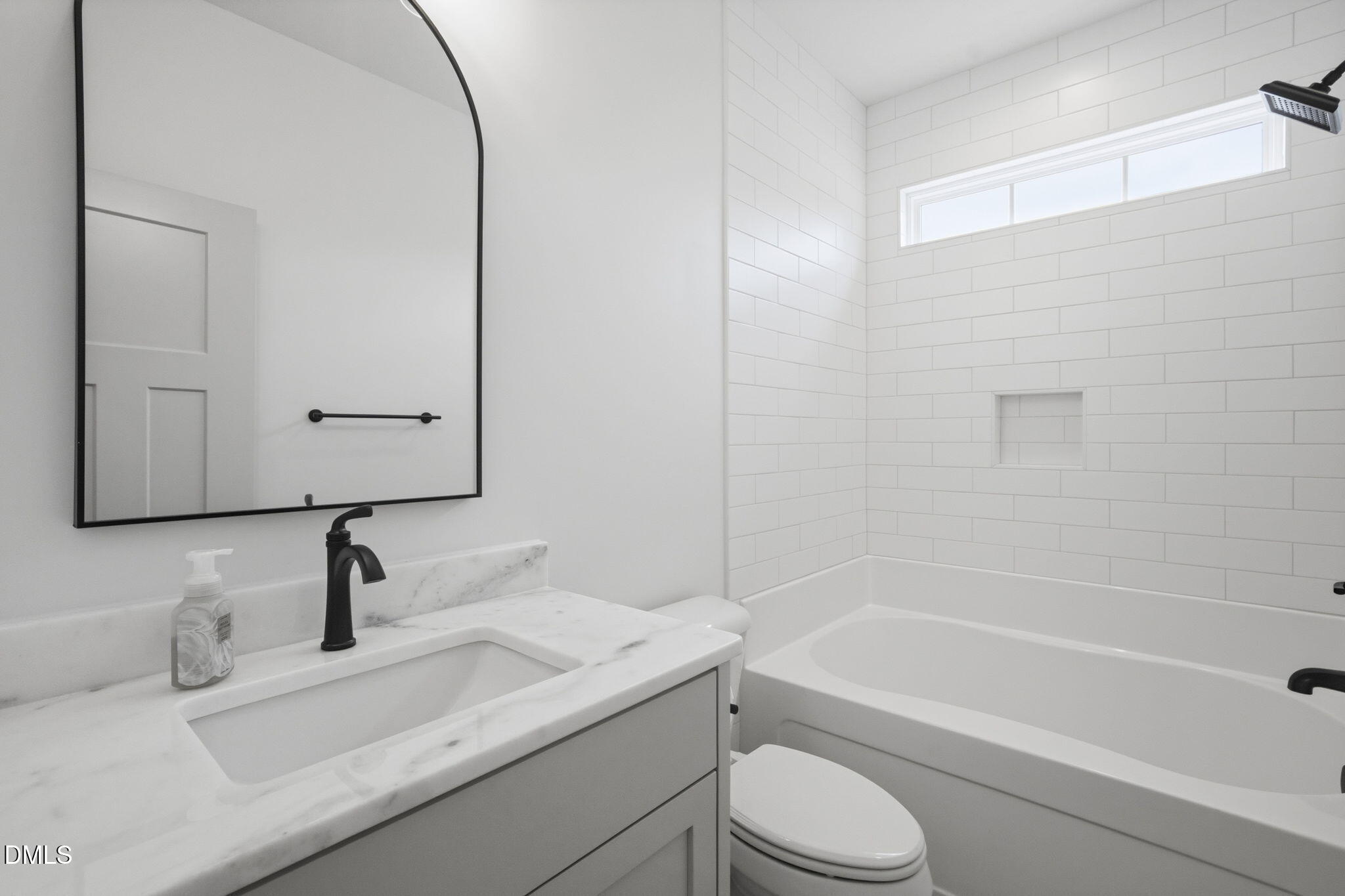 11214 Old Beulah Road Kenly, NC 27542 - Photo 24 of 56 a bathroom with a sink a toilet and a bathtub
