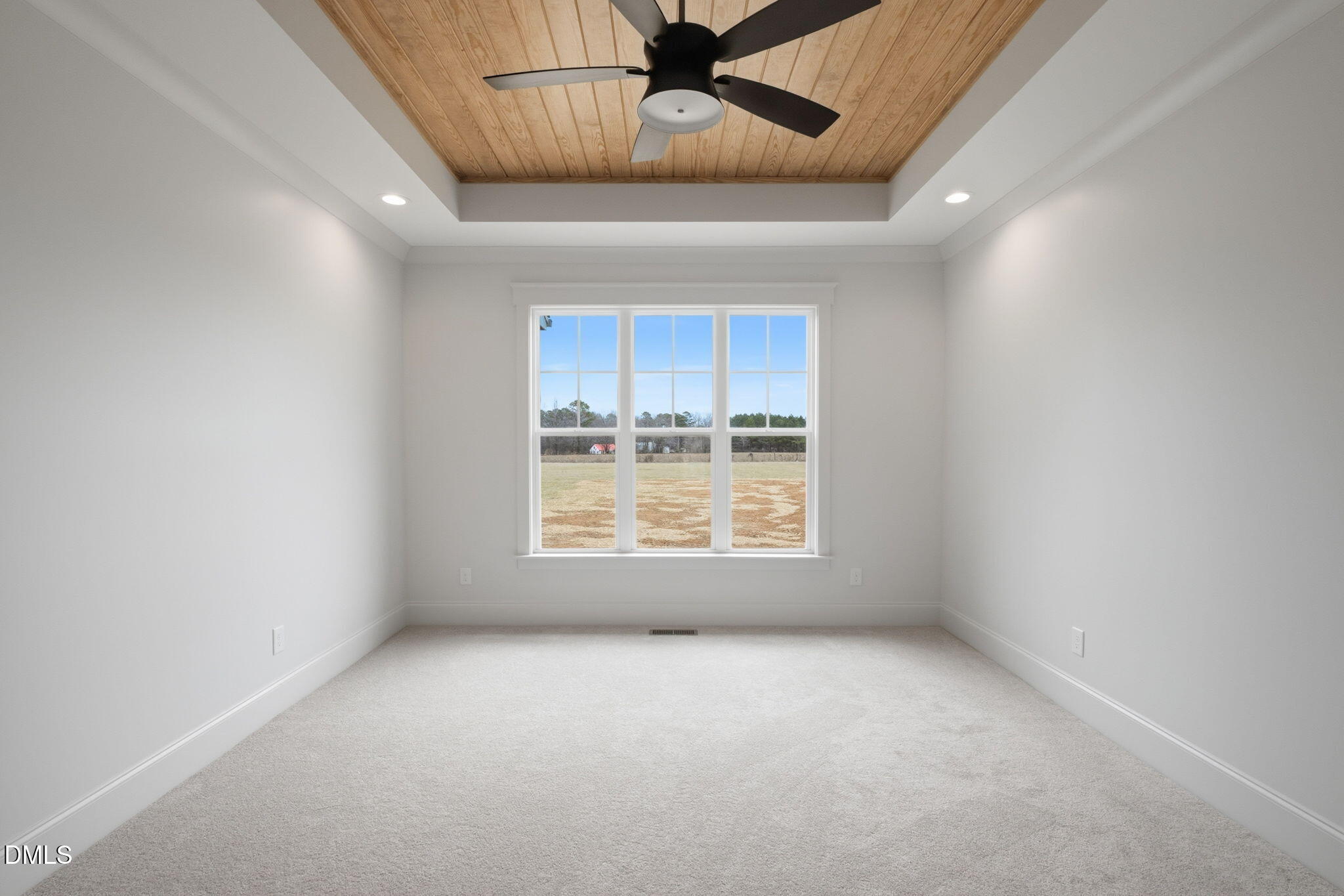 11214 Old Beulah Road Kenly, NC 27542 - Photo 26 of 56 an empty room with a ceiling fan and window