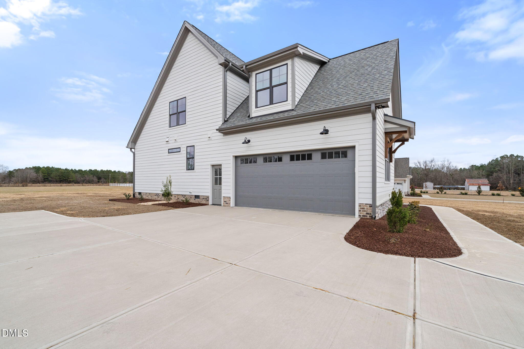 11214 Old Beulah Road Kenly, NC 27542 - Photo 3 of 56 a front view of a house with a yard and garage
