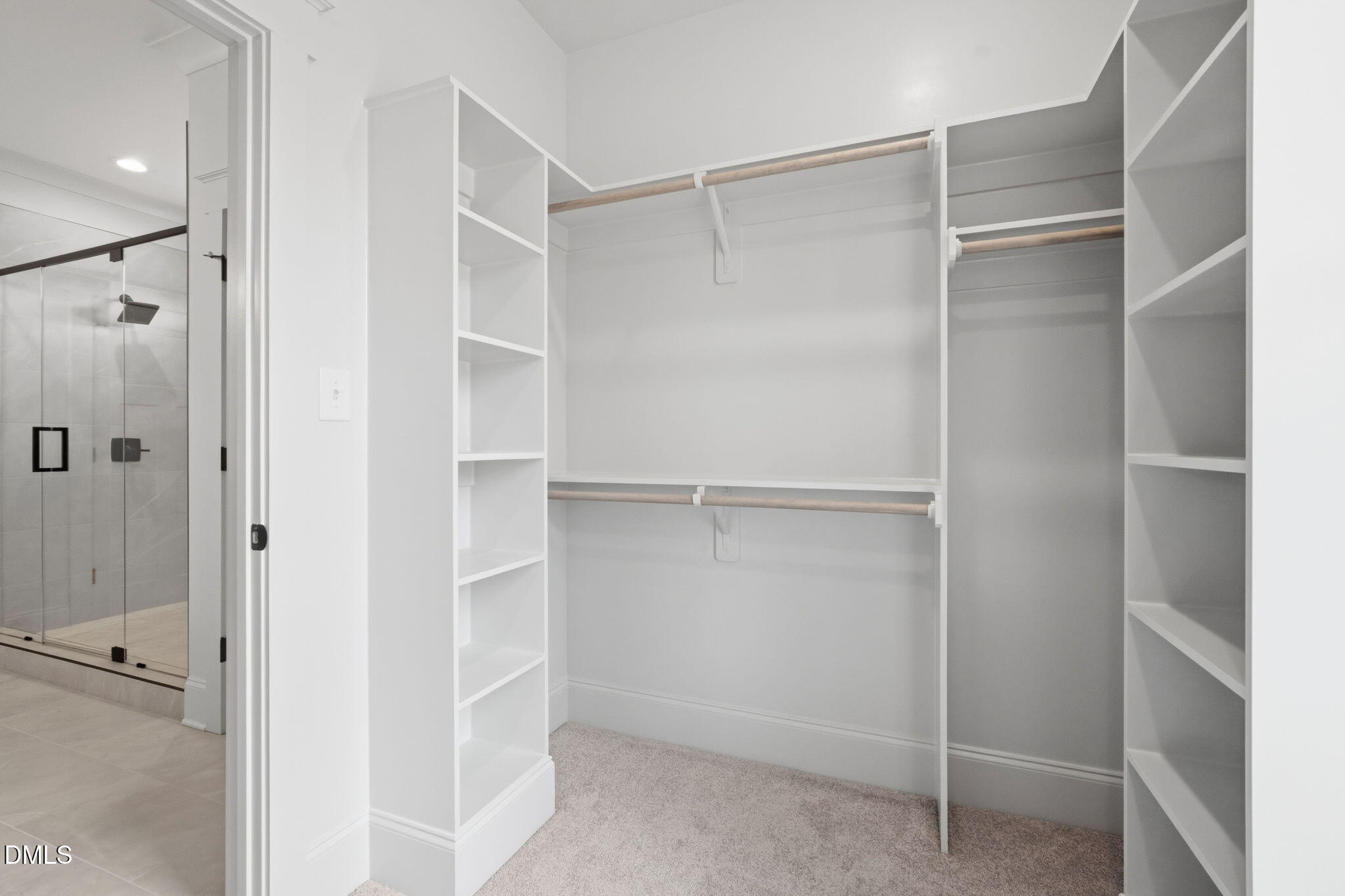 11214 Old Beulah Road Kenly, NC 27542 - Photo 31 of 56 a view of walk in closet with empty racks