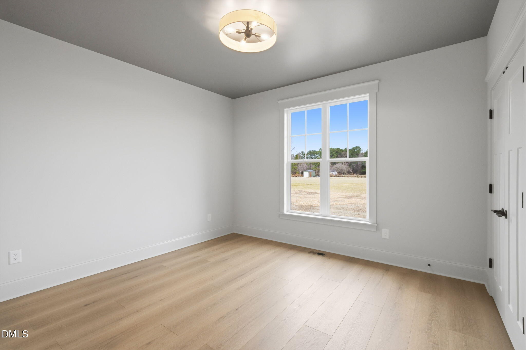 11214 Old Beulah Road Kenly, NC 27542 - Photo 33 of 56 an empty room with a window
