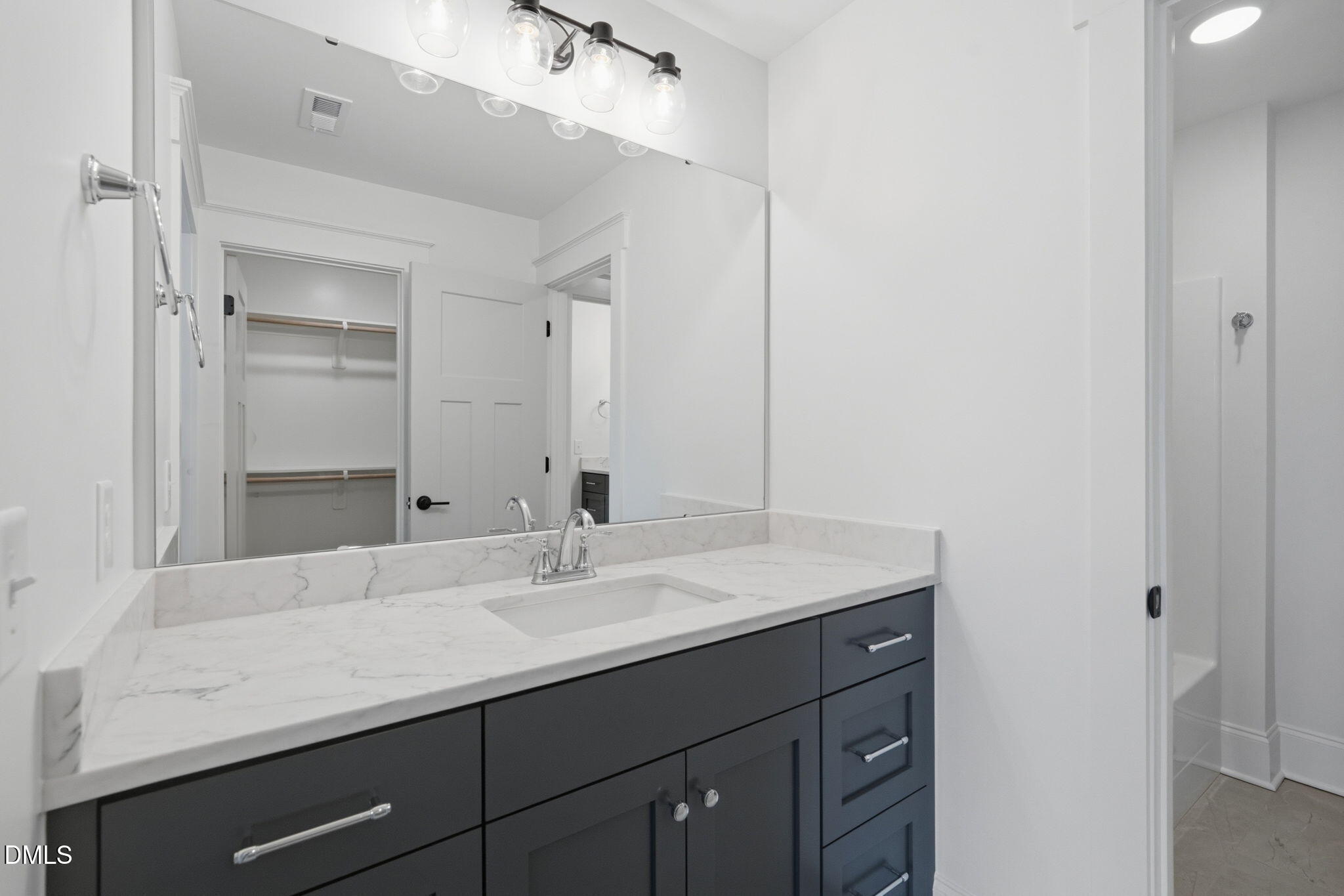 11214 Old Beulah Road Kenly, NC 27542 - Photo 39 of 56 a bathroom with a sink double vanity and a mirror