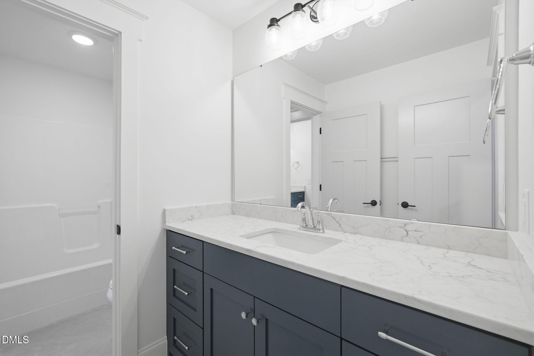 11214 Old Beulah Road Kenly, NC 27542 - Photo 41 of 56 a bathroom with a sink and a mirror