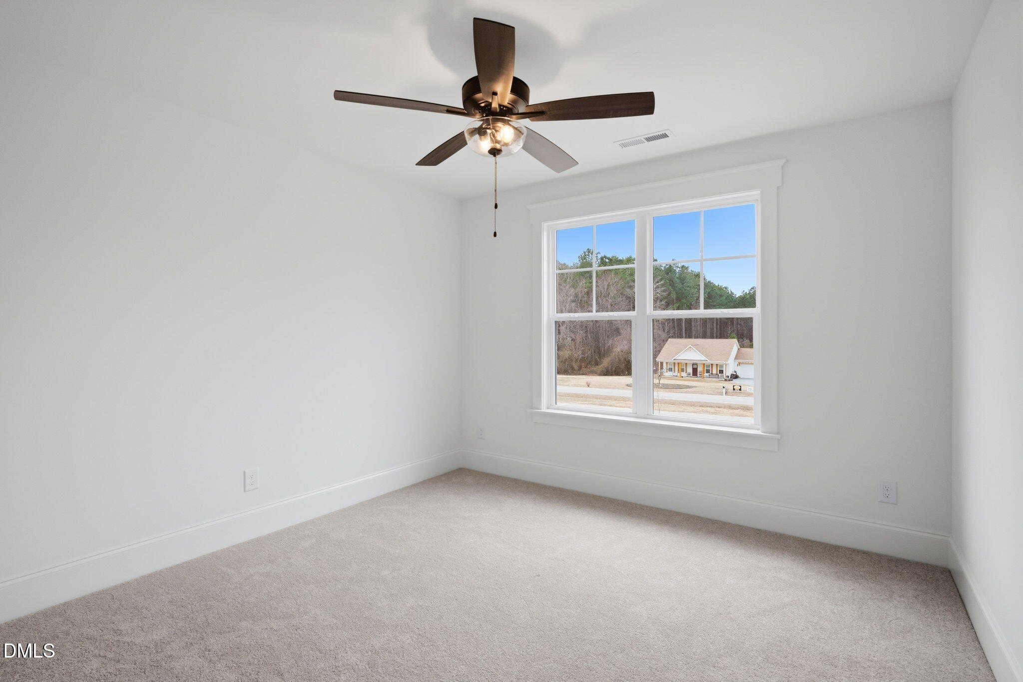 11214 Old Beulah Road Kenly, NC 27542 - Photo 43 of 56 a view of room with a ceiling fan and window