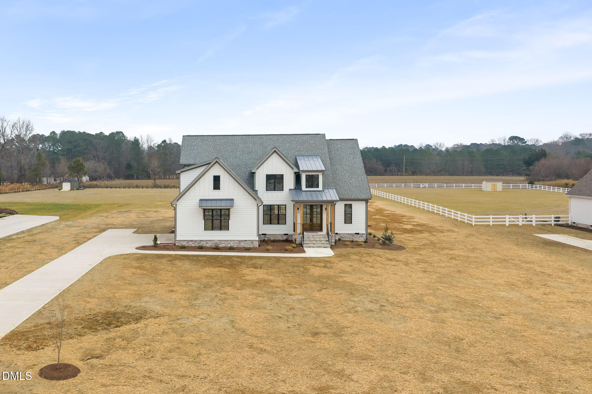 11214 Old Beulah Road Kenly, NC 27542 - Photo 53 of 56 a view of a big house with a lake view