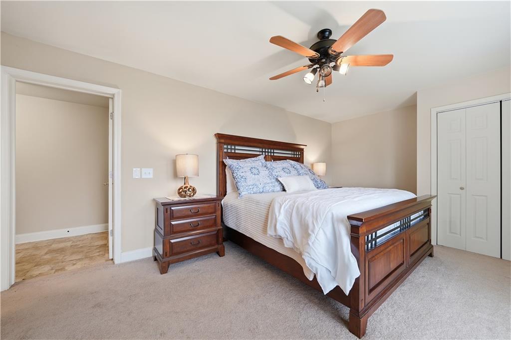 97 Eagle Ridge Trail Cleveland, GA 30528 - Photo 55 of 58 a bedroom with a bed and a ceiling fan