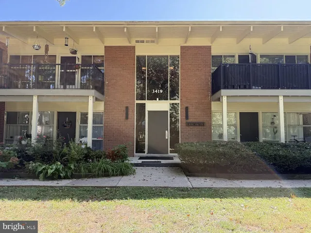 a view of a building with a yard