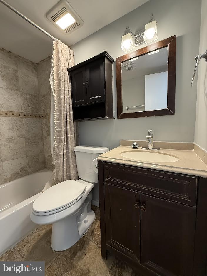 3419 University Boulevard West, Unit 203 Kensington, MD 20895 - Photo 12 of 25 a bathroom with a toilet a sink and bathtub