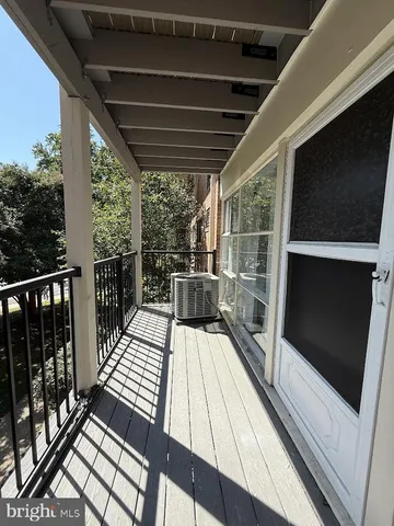 a view of outdoor space with wooden floor