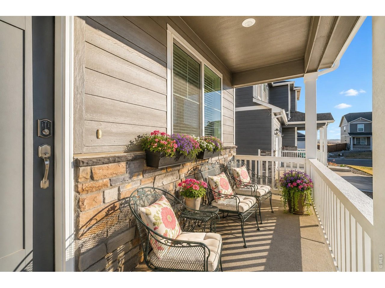 439 Bluebird Road Johnstown, CO 80534 - Photo 31 of 33 Covered front porch to enjoy your morning coffee!