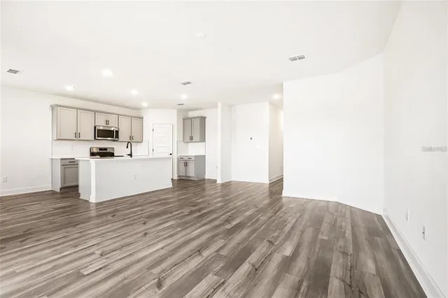 a view of kitchen with wooden floor