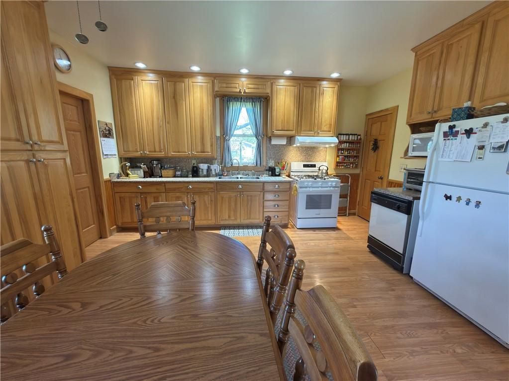122 Coal Bank Road Greenville, PA 16125 - Photo 22 of 50 a kitchen with stainless steel appliances granite countertop a stove refrigerator and cabinets