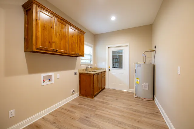 a kitchen with a refrigerator and a sink