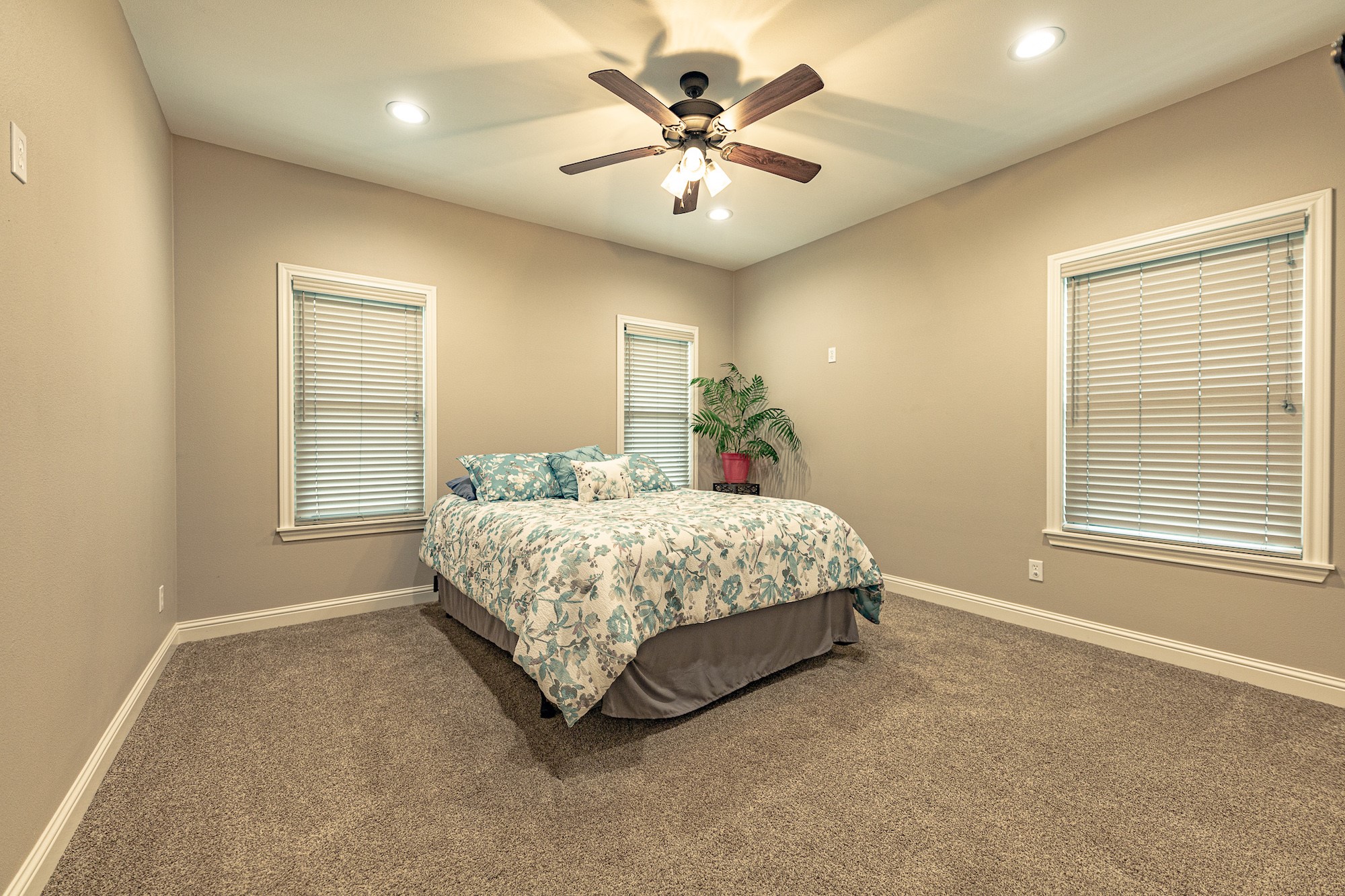 716 L Hrabovsky Road Yoakum, TX 77995 - Photo 14 of 42 a bedroom with a bed and a ceiling fan