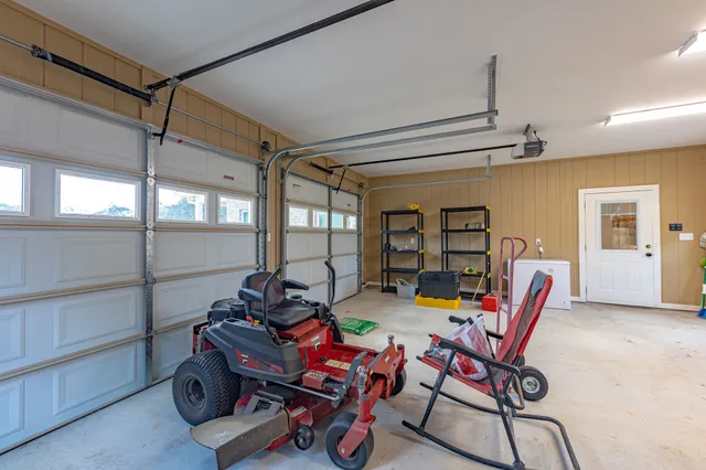 a dining room with furniture and a window